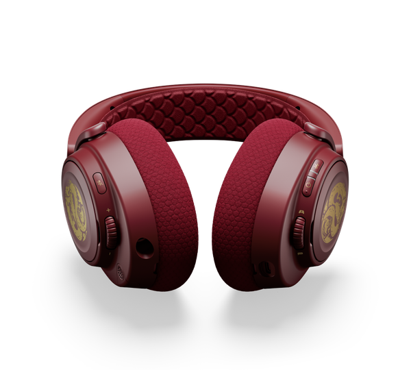 A close up look at the on-headset controls on the white Arctis Nova 7 Dragon Edition headset, featuring a mute button, volume control, power, and Bluetooth.