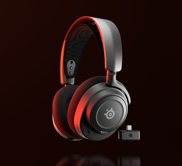 Arctis Nova 7 headphones with dongle next to it.